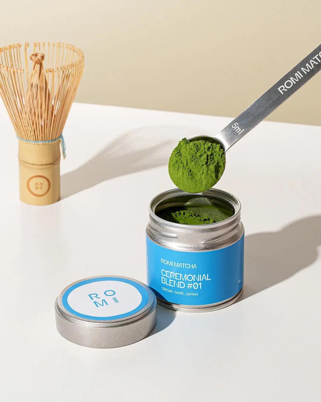 Romi Matcha Ceremonial Blend #01 30g tin with matcha in a measuring spoon