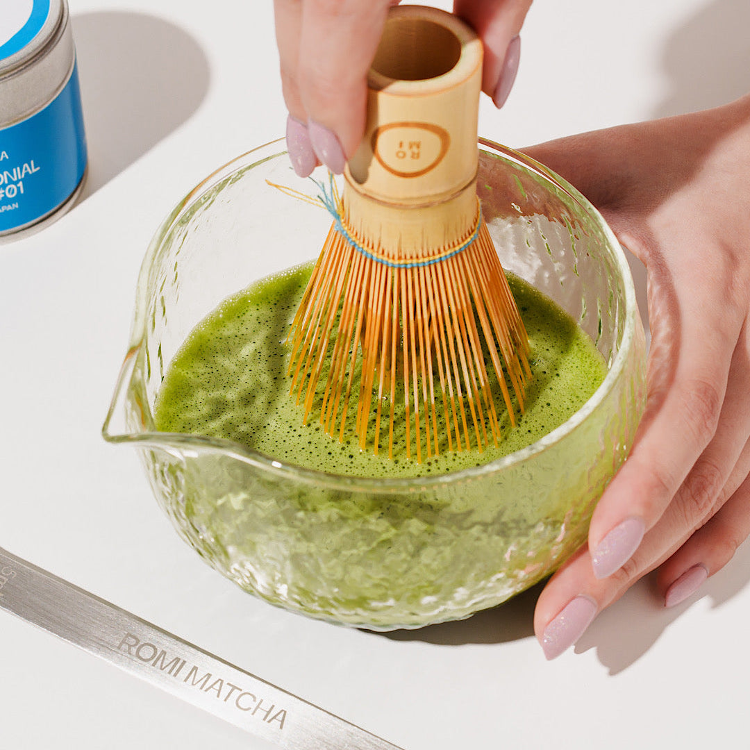 Romi Matcha in a bowl with bamboo whisk 