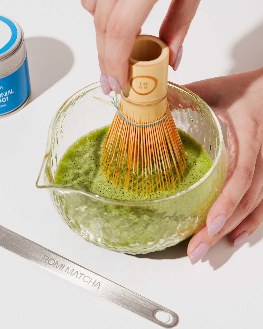 Romi Matcha in a bowl with bamboo whisk 
