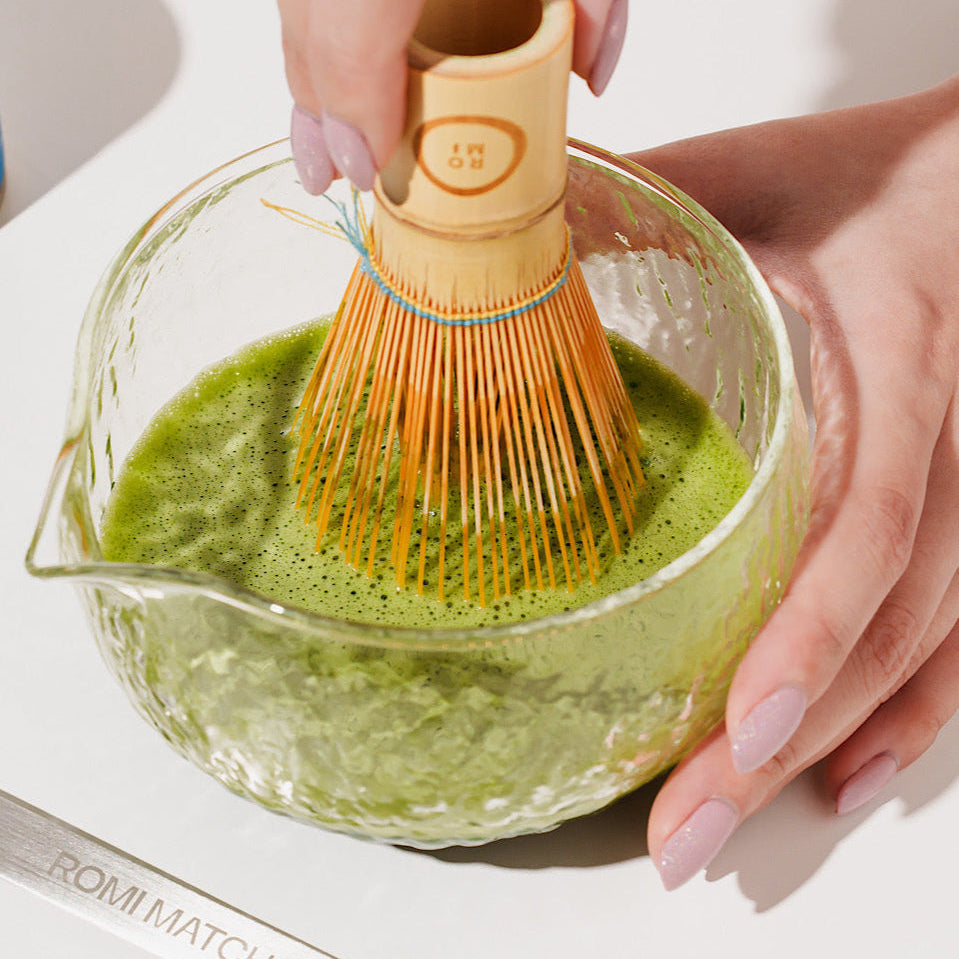 Matcha in a bowl with bamboo whisk | Romi Matcha
