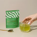 Kabusecha Premium Shaded Green Tea 50g package and glass on beige background | Romi Matcha