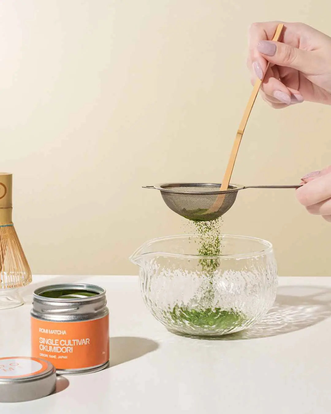 Romi Matcha Okumidori with sieve and bamboo spoon in a bowl | Romi Matcha