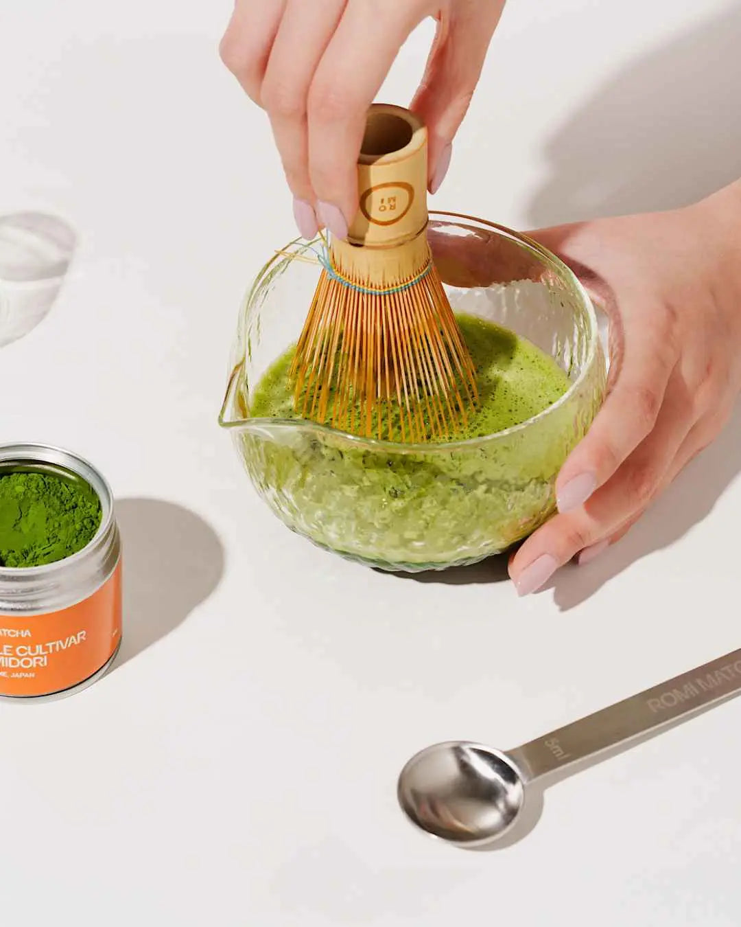 Romi Matcha Okumidori Single Cultivar with matcha in a bowl and bamboo whisk | Romi Matcha