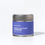 Matcha tea canister with purple label on a white background